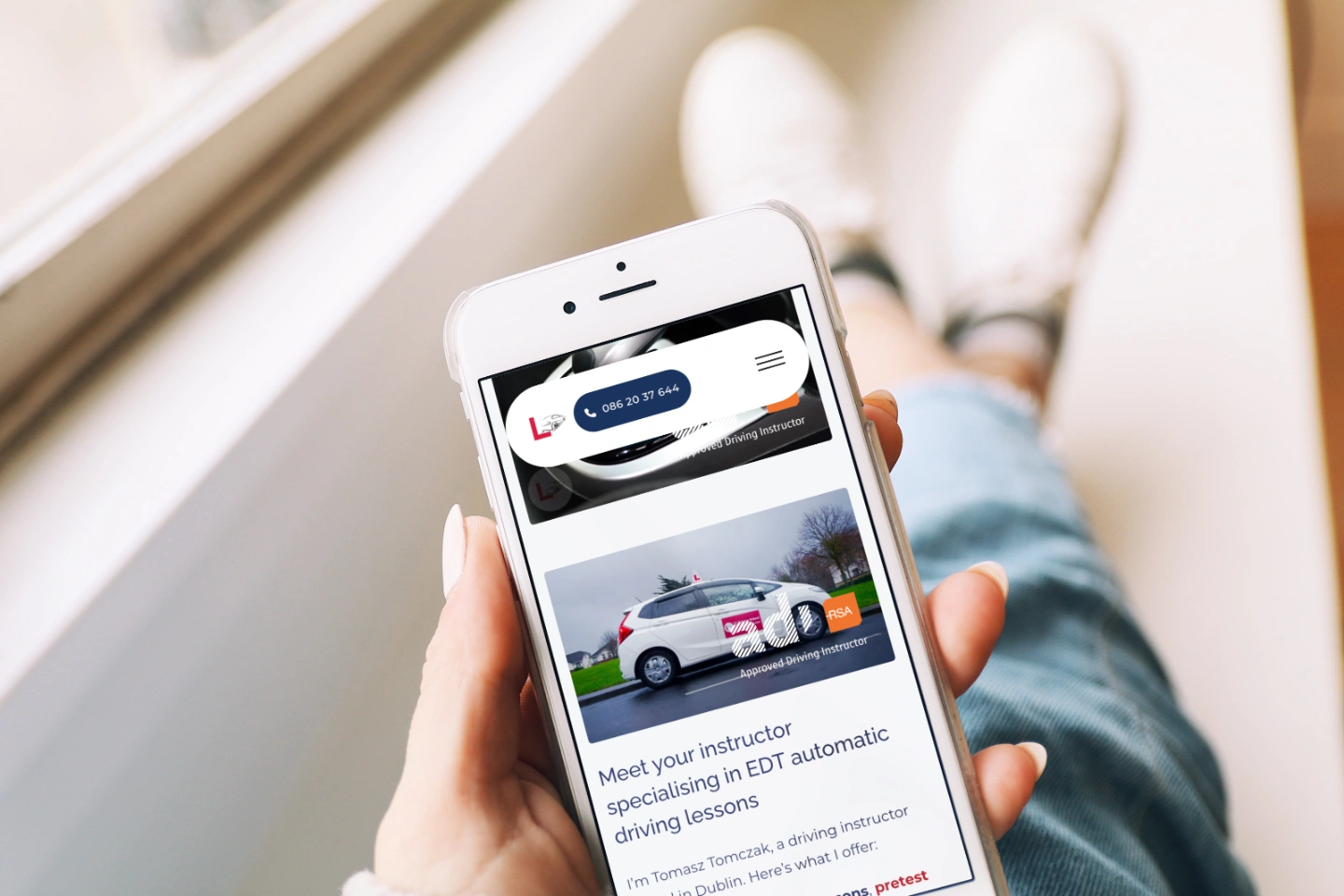 person browsing ttdrivingschool on the iphone showcase
