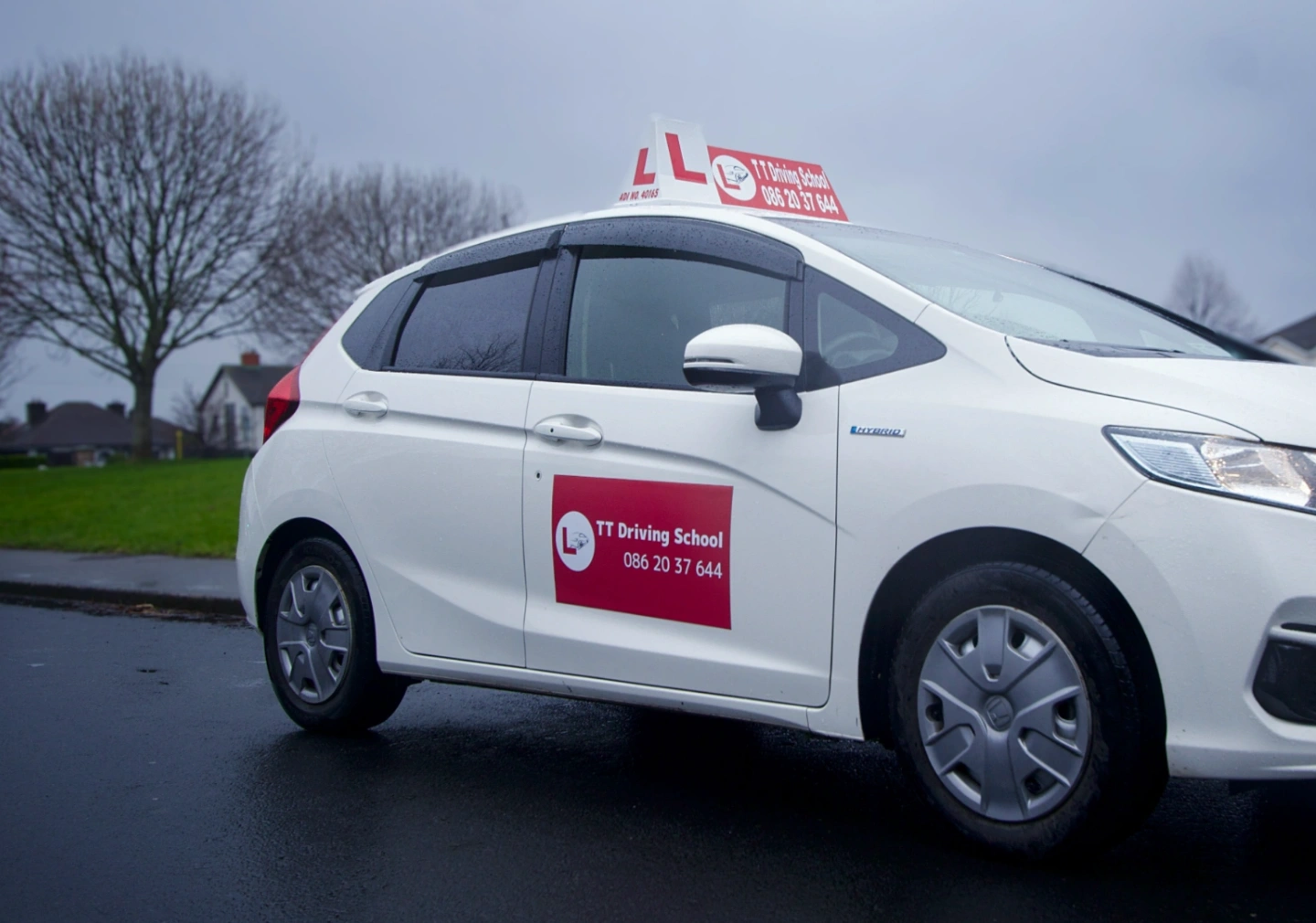 tt driving school logo on the car